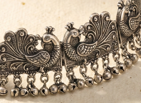 Macro of the ghungroo bells and peacock relief